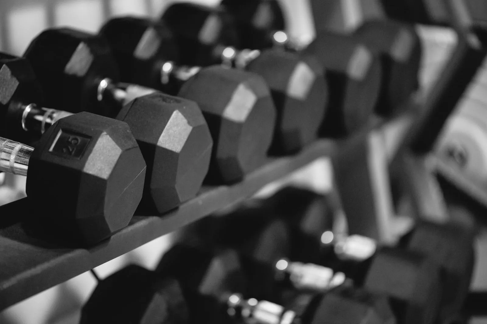 A close-up of the hex dumbbell rack, in black and white.